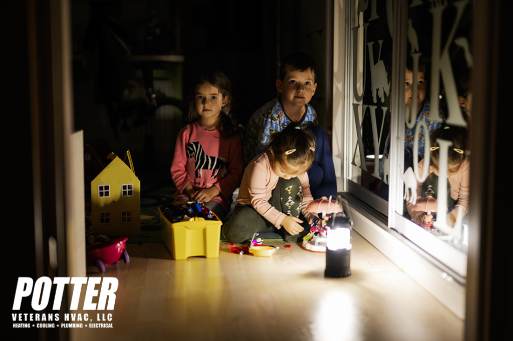 Kids playing at home during a power outage using lantern