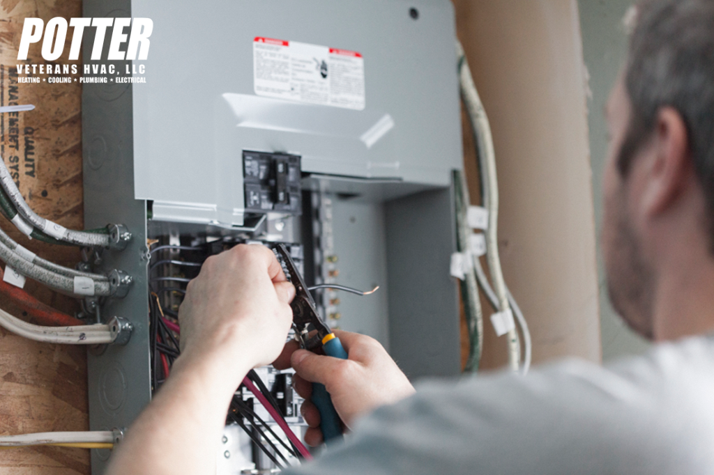 Electrician replacing the distribution board to upgrade a homes electrical panel.